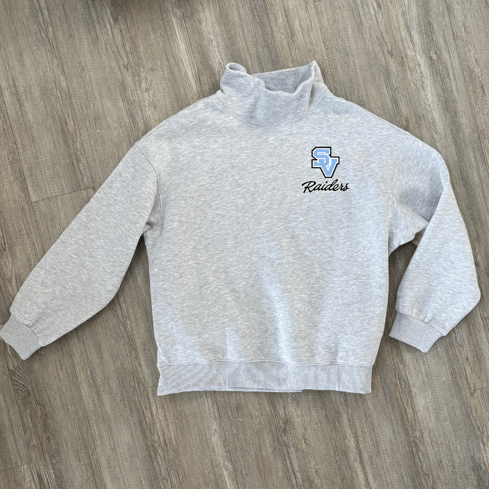 A light heather gray long-sleeve mock neck sweatshirt with a SV logo on the left chest above the word 'Raiders' in black script.