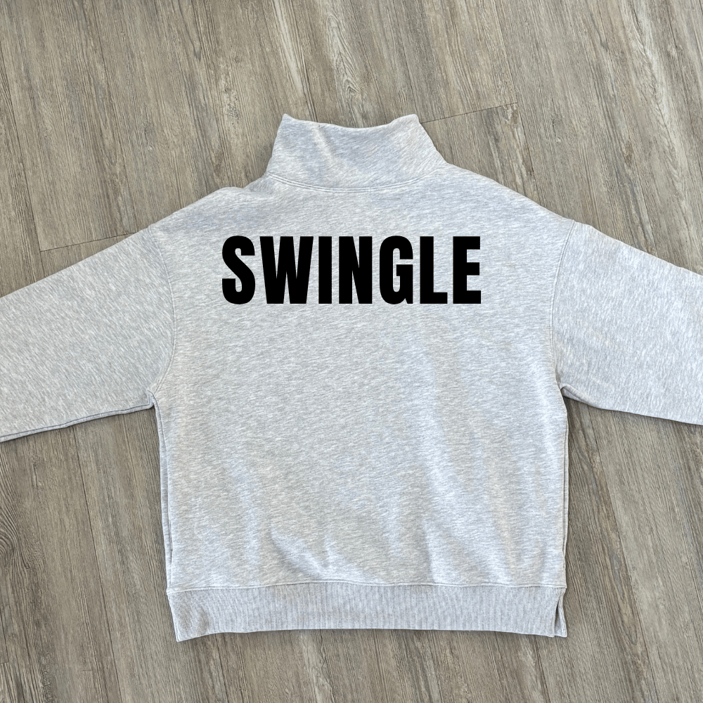 A light heather gray mock neck sweatshirt with a custom last name printed in bold black capital letters across the back.